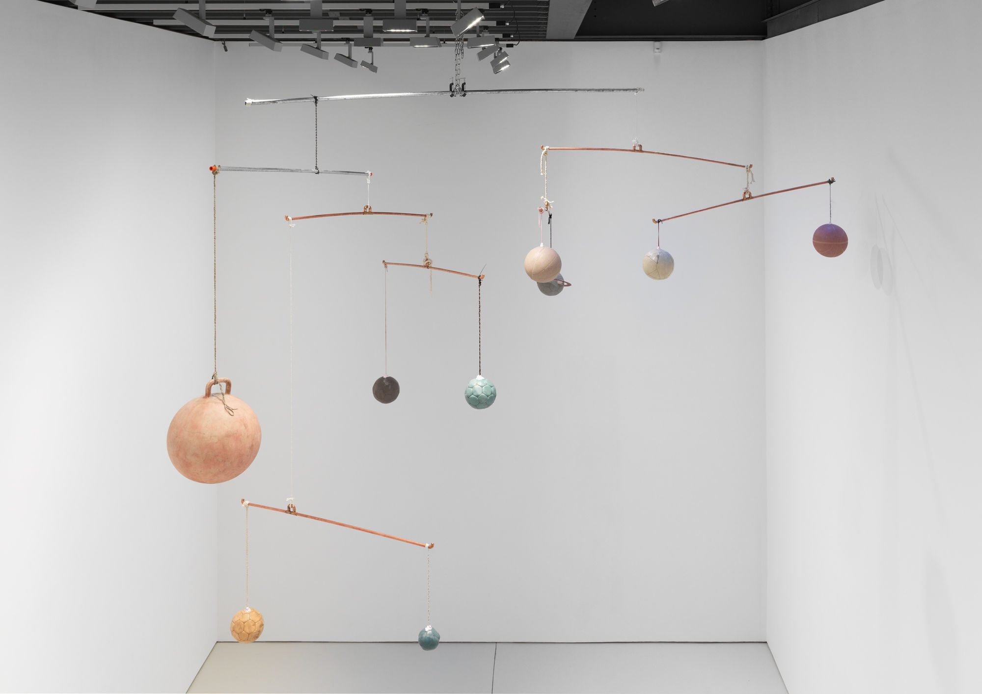 Installation views of the many sculptural works in Richard Hughes' solo exhibition at the gallery. Hughes' hanging interplanetary sculpture seen here.