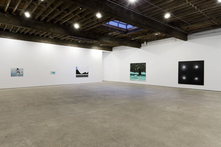 Installation view of Wilhelm Sasnal's fourth solo show at Anton Kern gallery, featuring a body of paintings organized around subject matters concerning personal contemporary life. Distant shot of main gallery floor, multiple works featured.