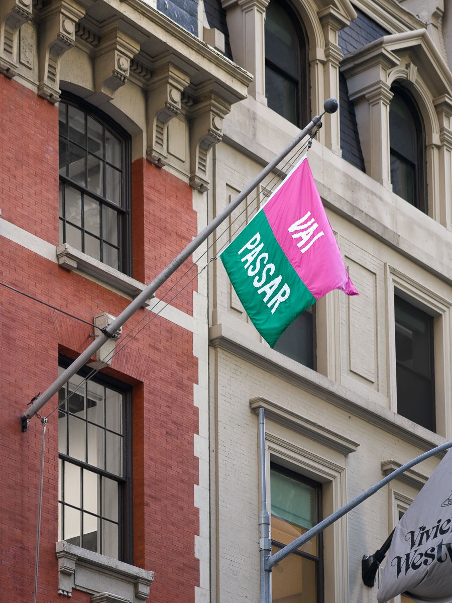 installation view of group show 'Samba in the Dark'. Marcos Chaves' flag waving outside the gallery.