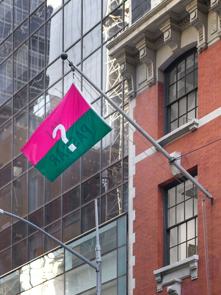 installation view of group show 'Samba in the Dark'. The question mark on the back of Chaves' flag titled "Vai Passar?" or "Will it pass?"
