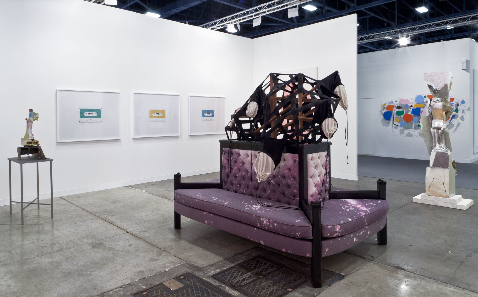 Installation view of the AKG booth at Art Basel Miami 2014. Another detail shot of Lara's couch alongside Anne Collier's works.