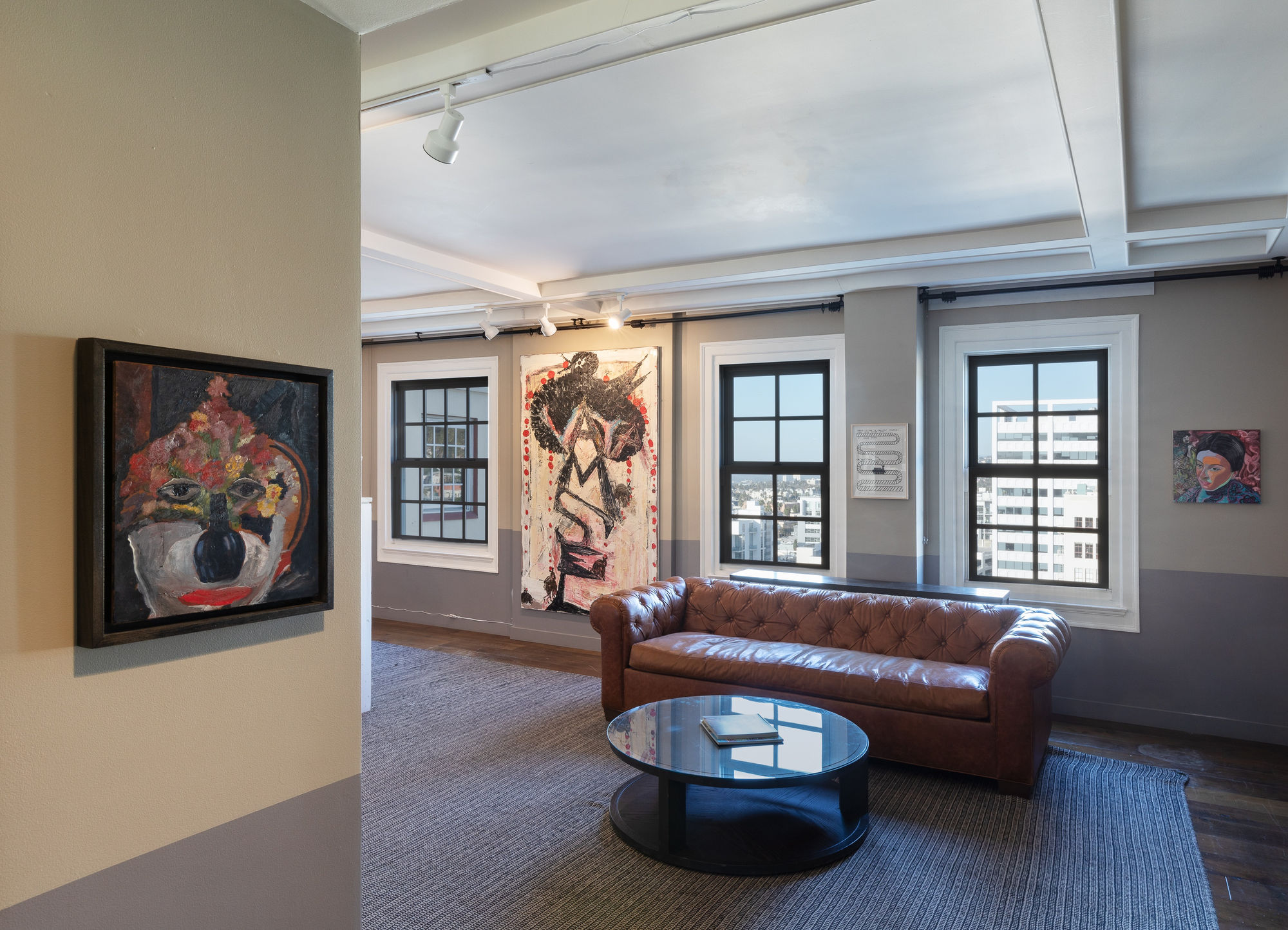 Installation views during Felix Art Fair. Mix of paintings and sculptures by various artists, including Lara Schnitger, Mark Grotjahn, and others.