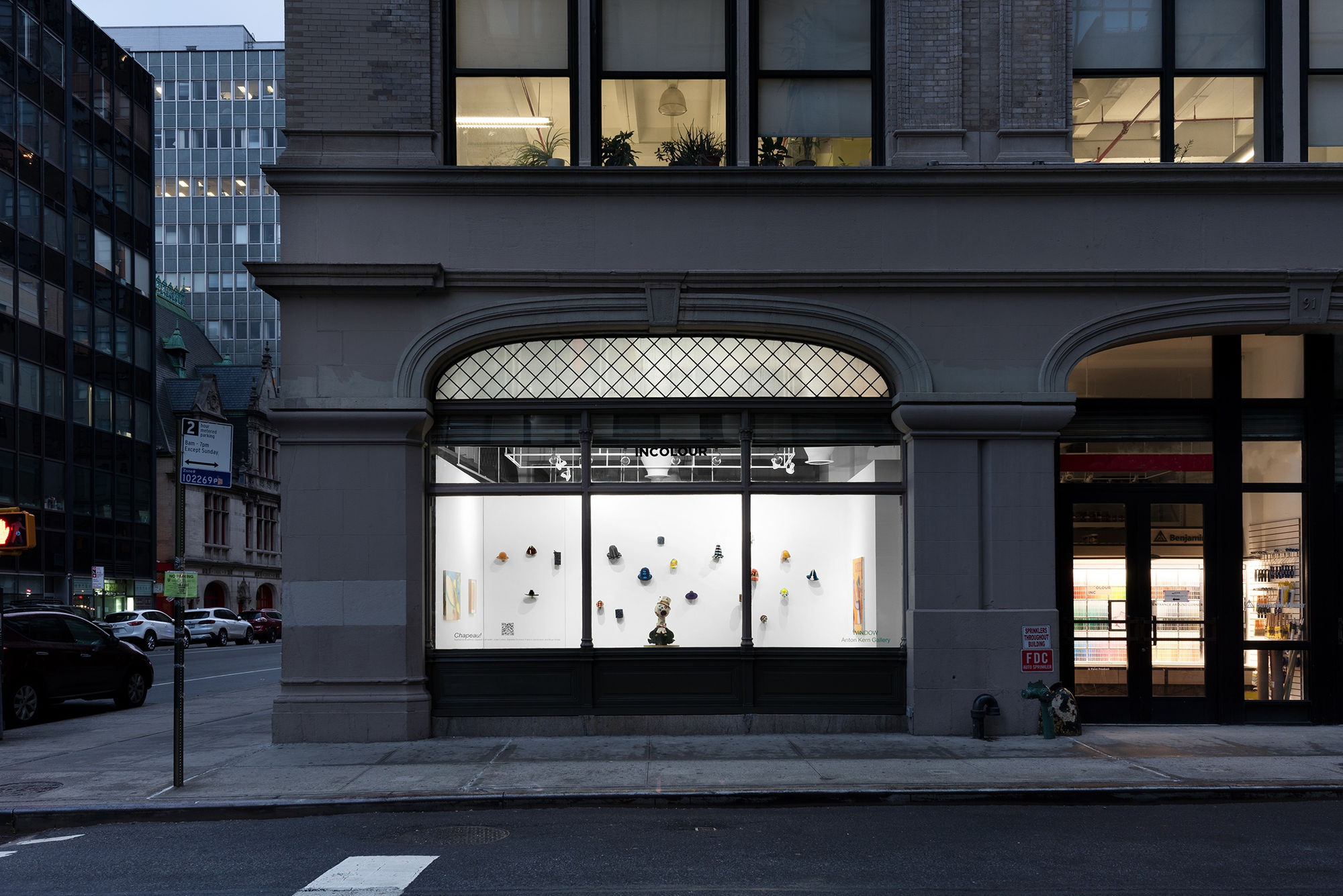 Installation view of the 2022 exhibition “Chapeau!” with exterior view of walls, artworks and ceiling.