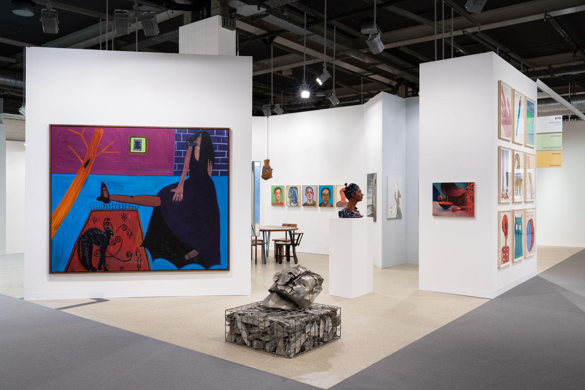 Installation view of Art Basel 2023 booth K10 with view of floors, walls, artworks and ceiling.