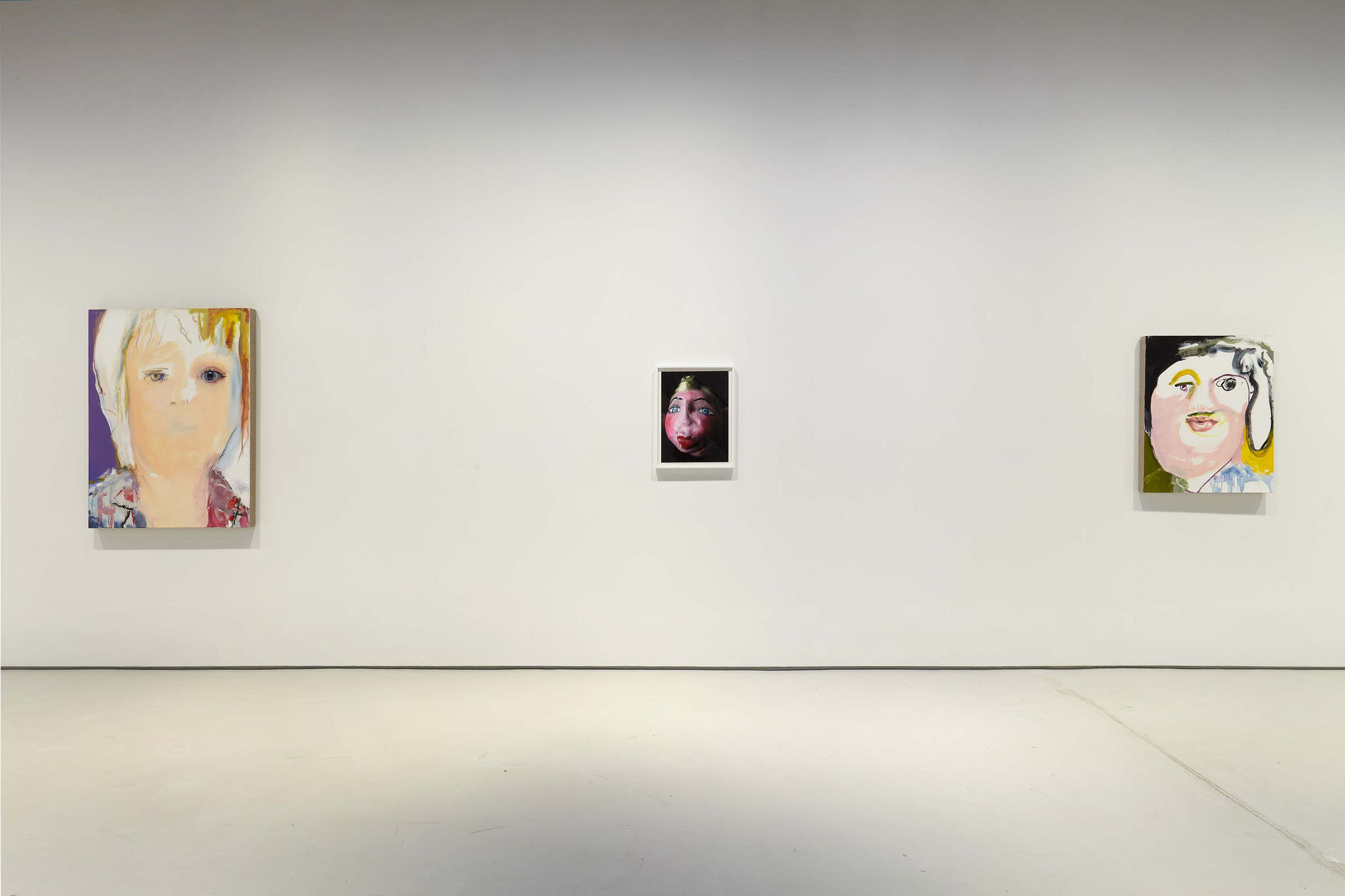 Installation view of figurative portrait paintings made by Margot Bergman. One work showcased.