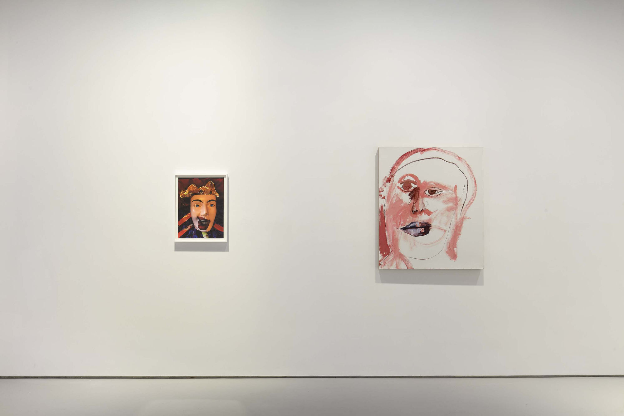 Installation view of figurative portrait paintings made by Margot Bergman. Two works presented.