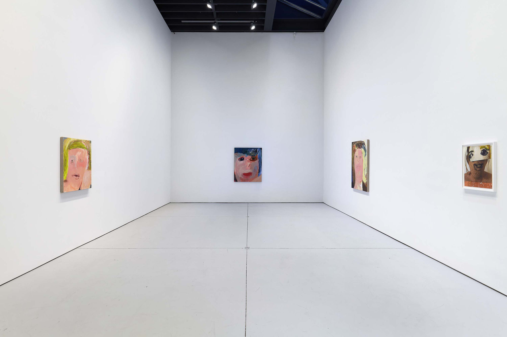 Installation view of figurative portrait paintings made by Margot Bergman. Two paintings featured,