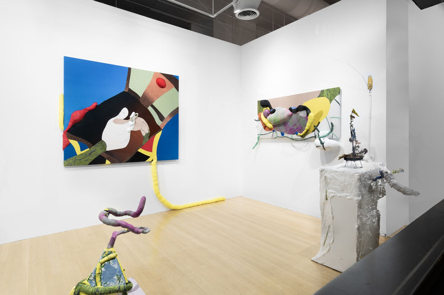 Installation view of the 2023 exhibition “Yuli Yamagata: The new, the old, and the hole” with view of wood floors, walls, artworks and ceiling.