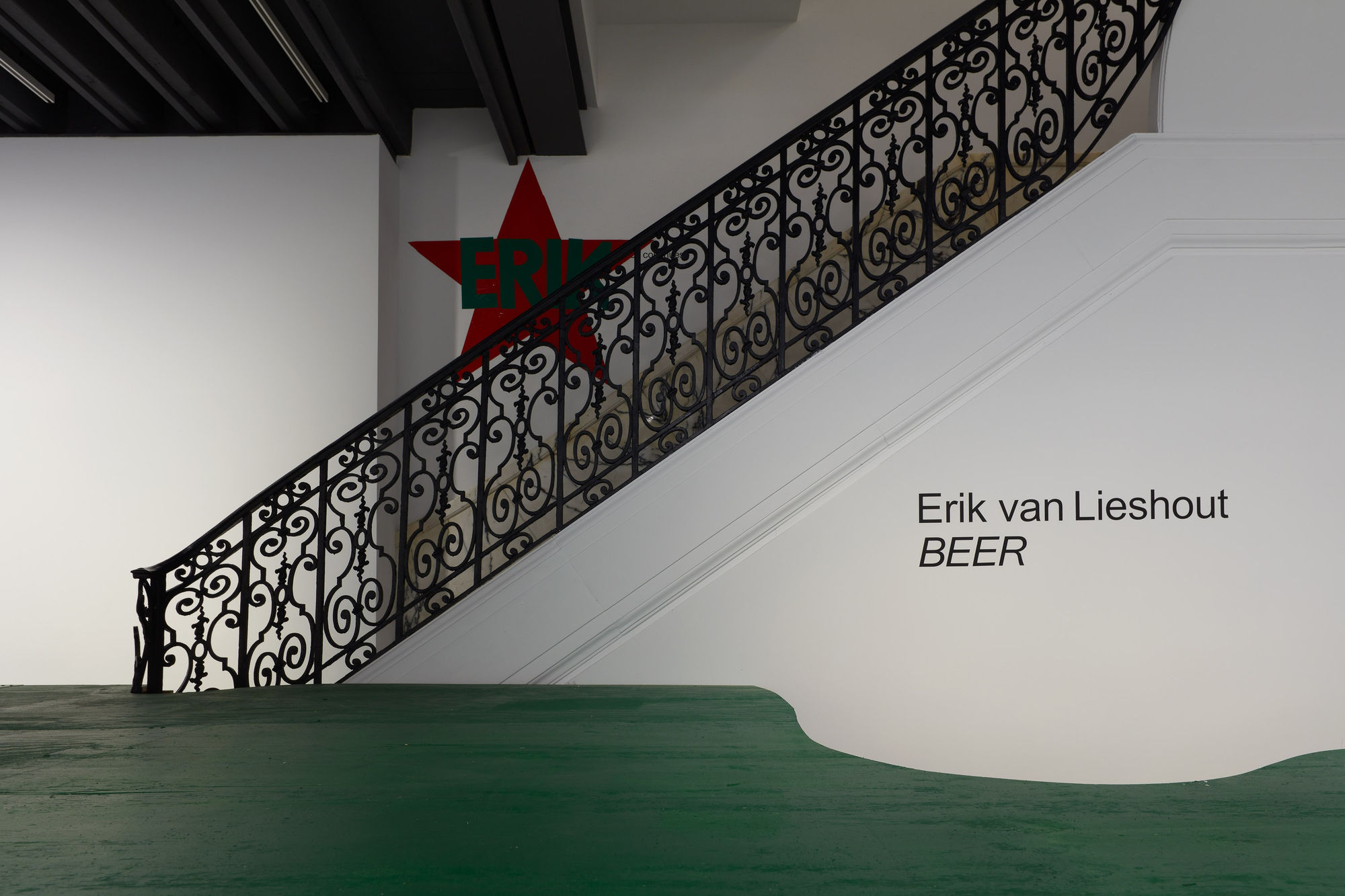 Installation view of Erik van Lieshout's exhibition at the gallery 'BEER' -- featuring an immersive Heineken installation and new collages.