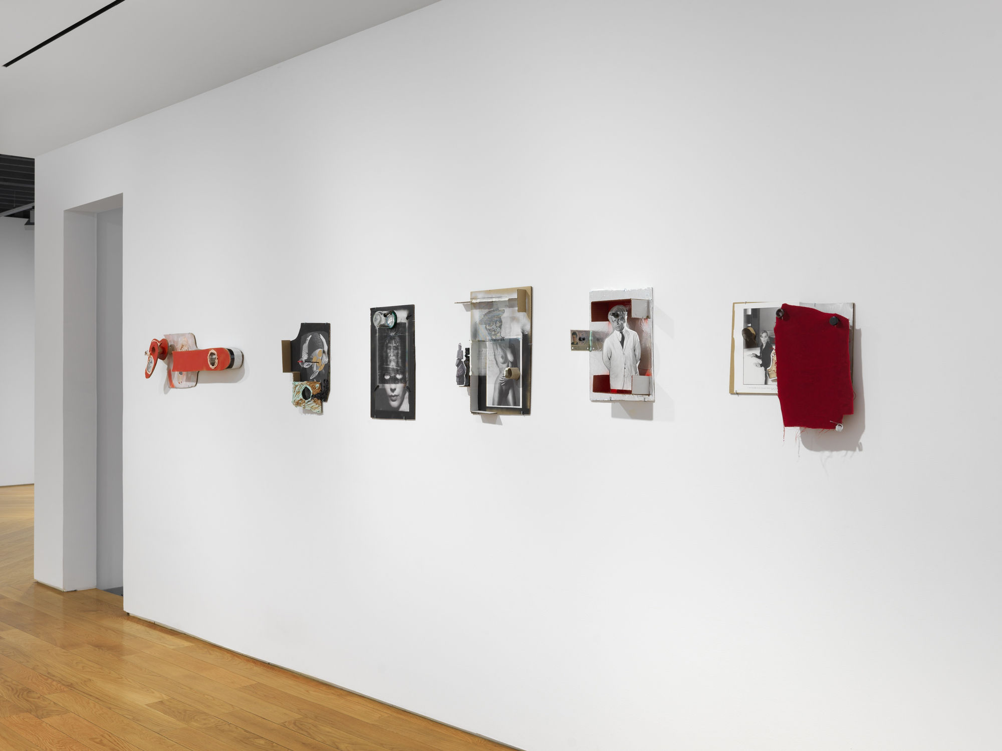 Installation view on the gallery's third floor of collages, which are 3 dimensional, unique, and vary in shape and content. Many works shown.