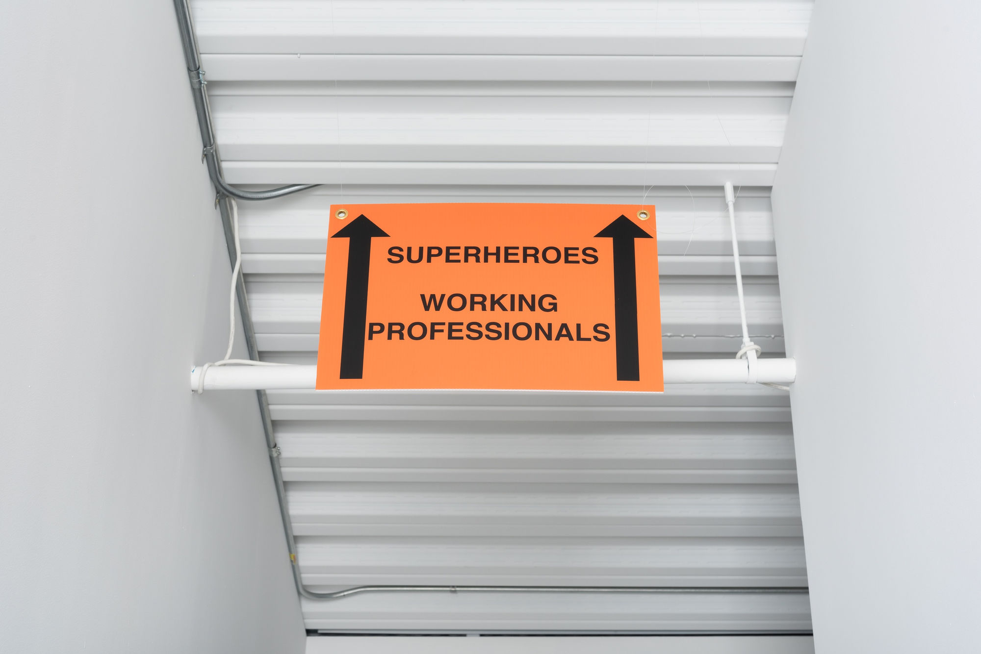 SUPERHEROES WORKING PROFESSIONALS, 2024 Corrugated cardboard, grommets 12 x 15 x 1/4 inches