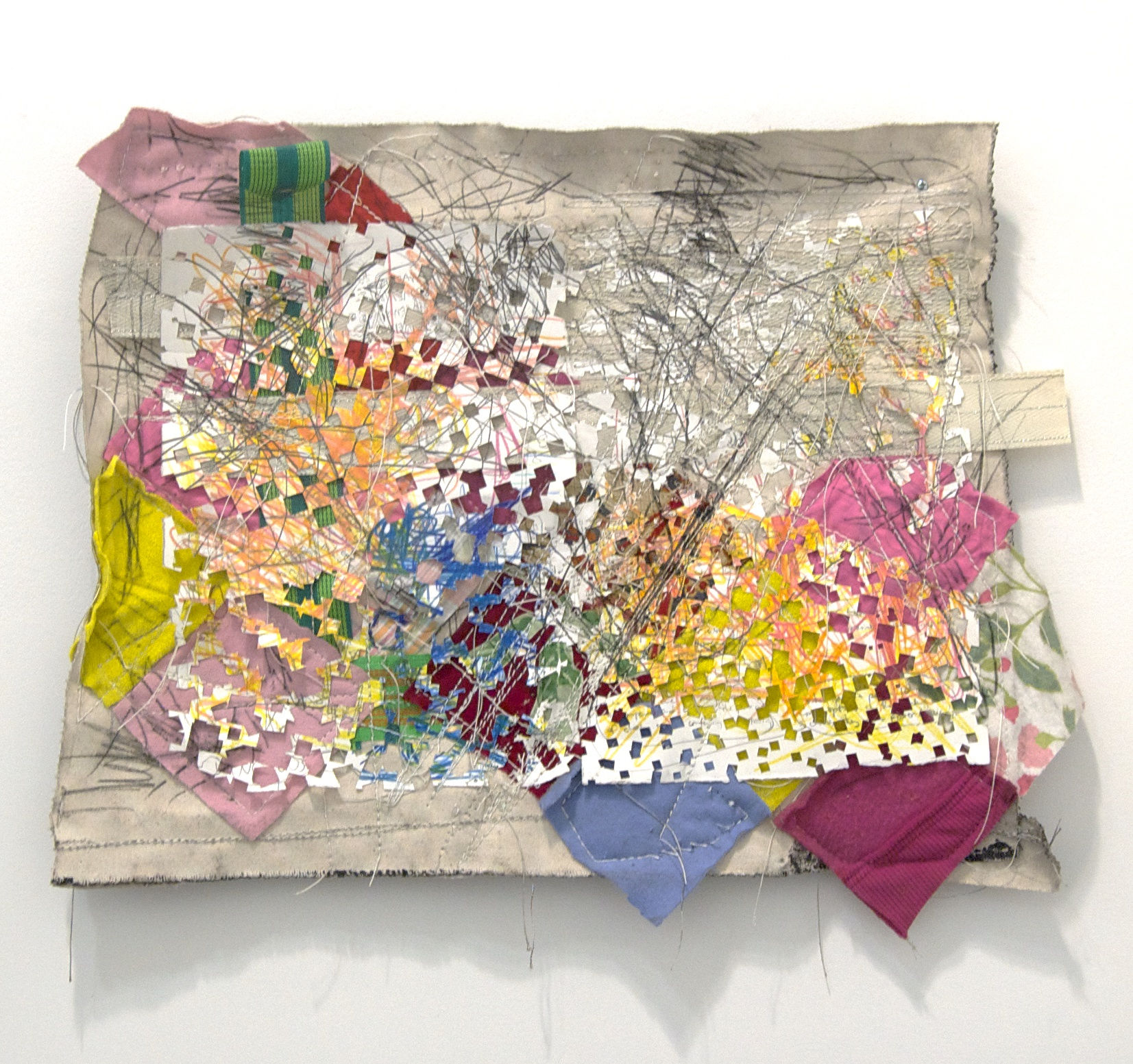 Sculpture created from canvas, colored pencil, fabric, graphite, gesso, hardware, paper, thread and wood installed on the wall