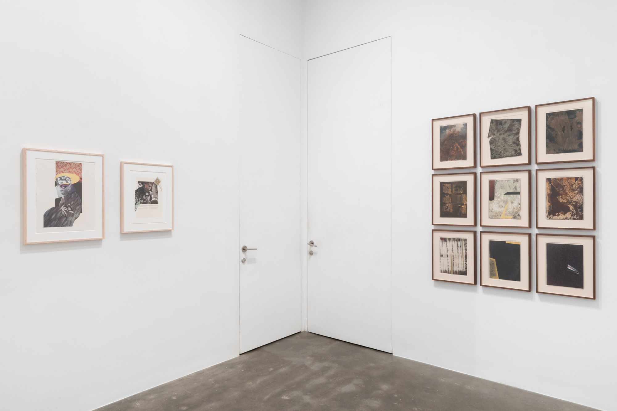 Installation on two walls of framed drawings and paper works by Marcia Kure