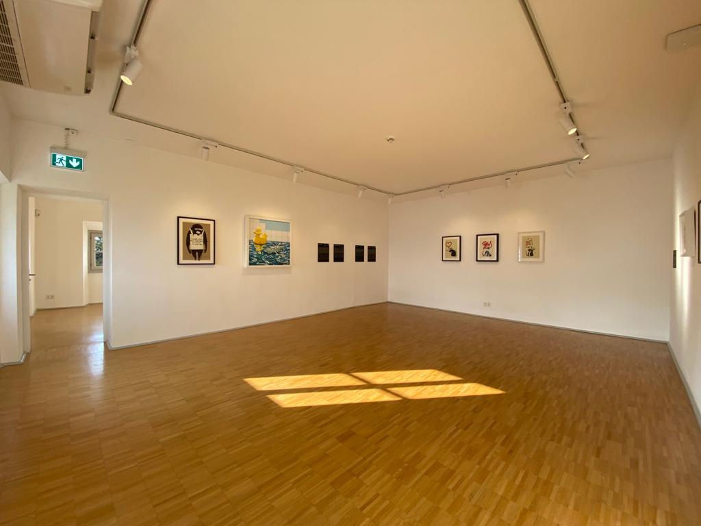 Banksy artworks hanging on wall