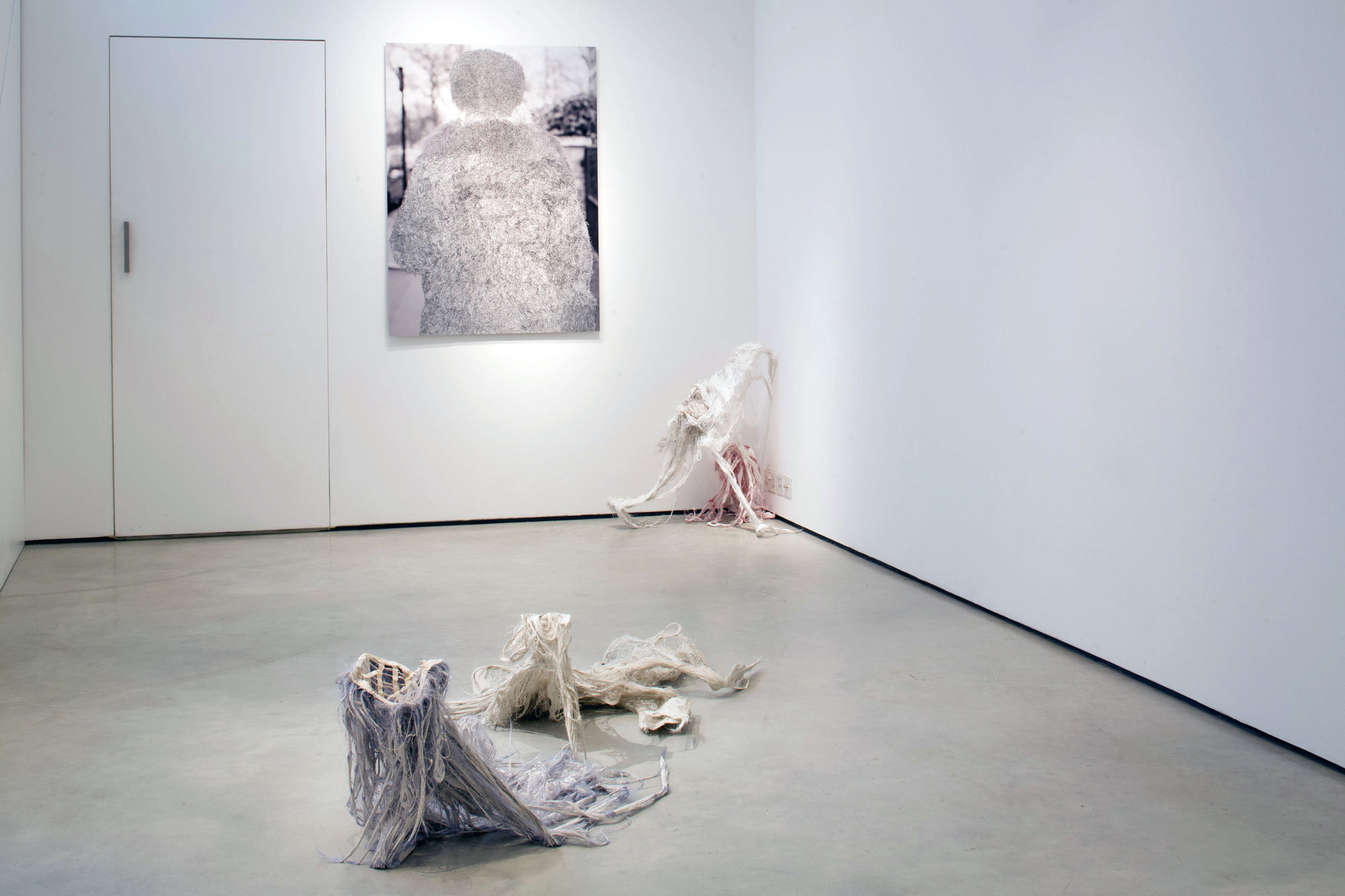 Mackrell artworks hanging on wall and floor