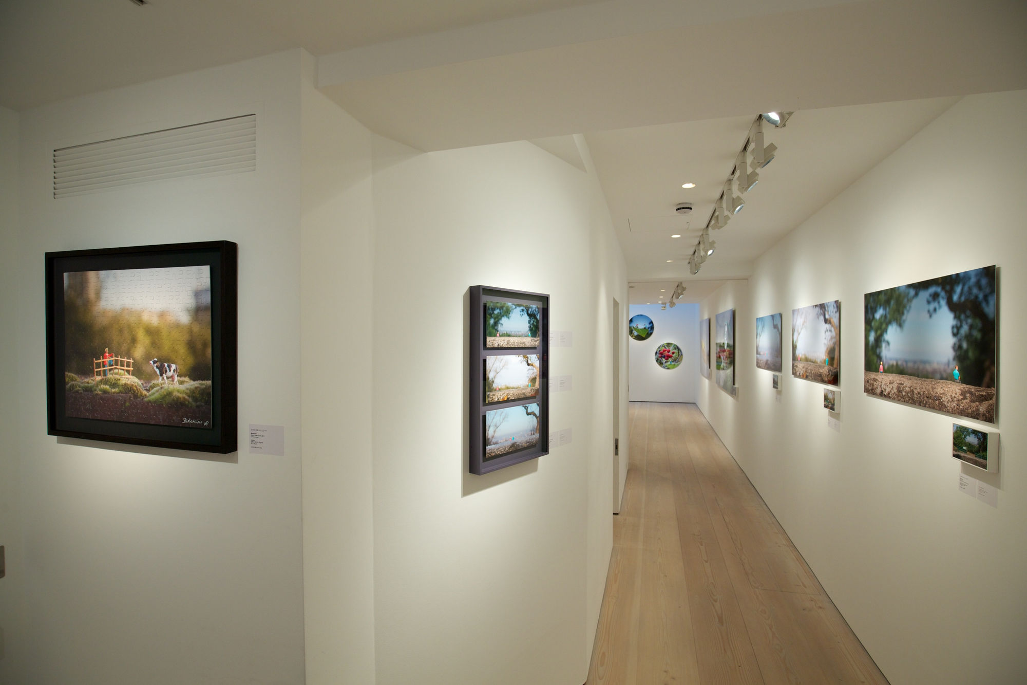 Slinkachu prints hanging in exhibition at andipa gallery.