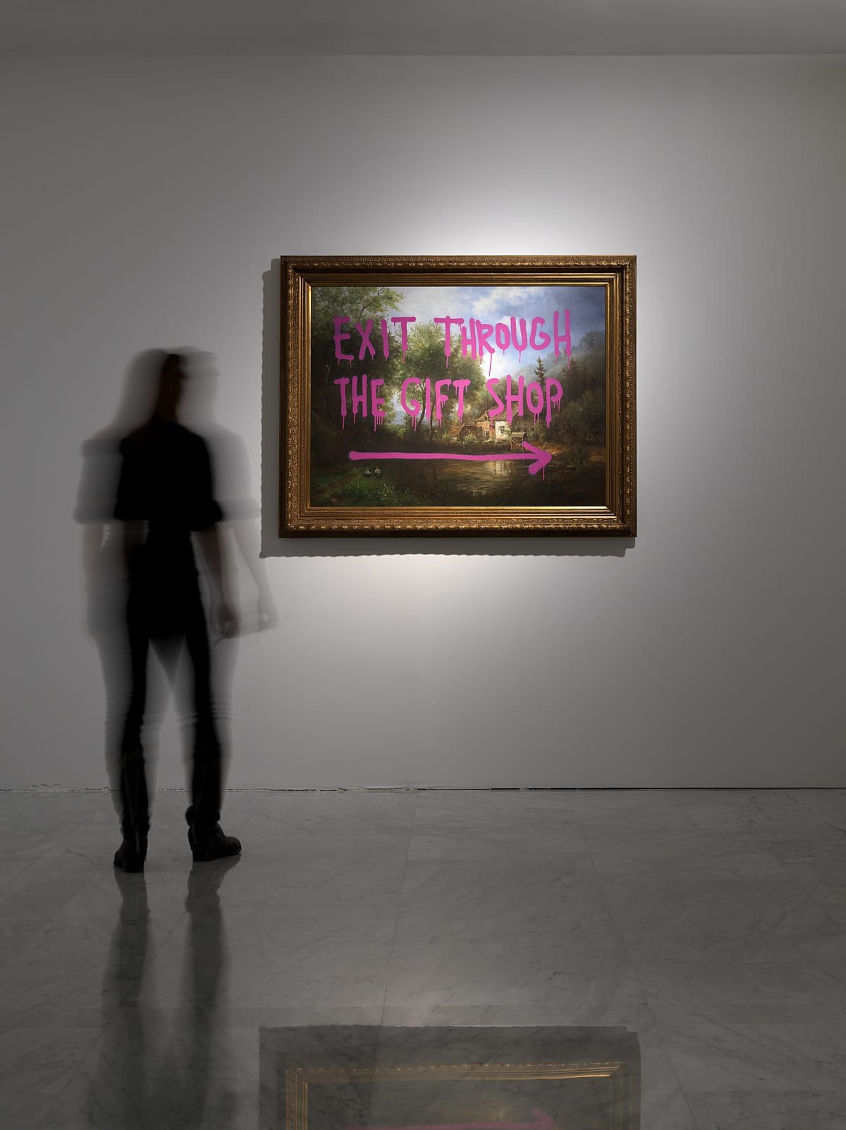 Banksy artworks hanging on wall