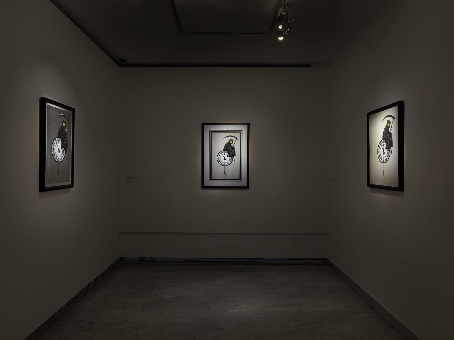 Banksy artworks hanging on wall