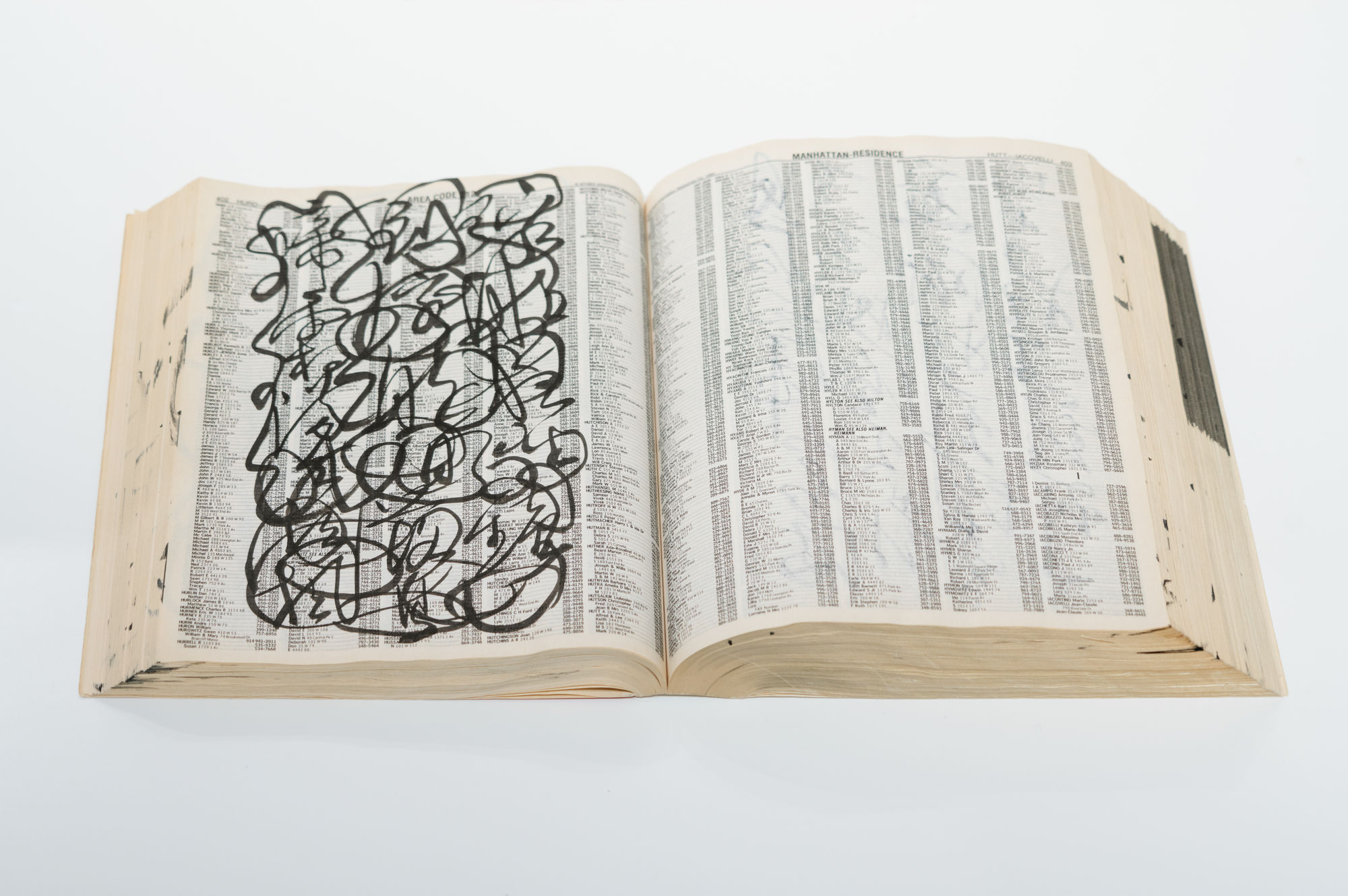 C.C. Wang's calligraphic writing on a phone book