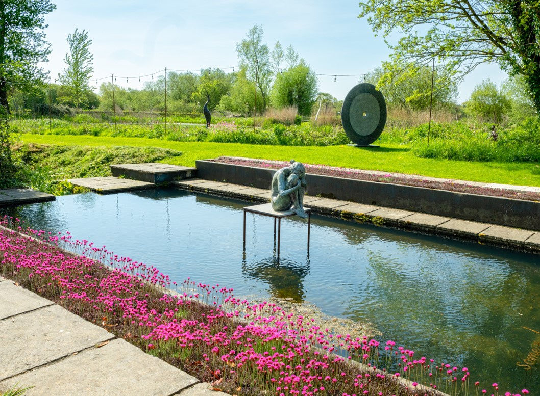 Foreground: Louise by David Williams-Ellis in front of Singularity by Jonatha Loxley Background: Origins by Simon Gudgeon