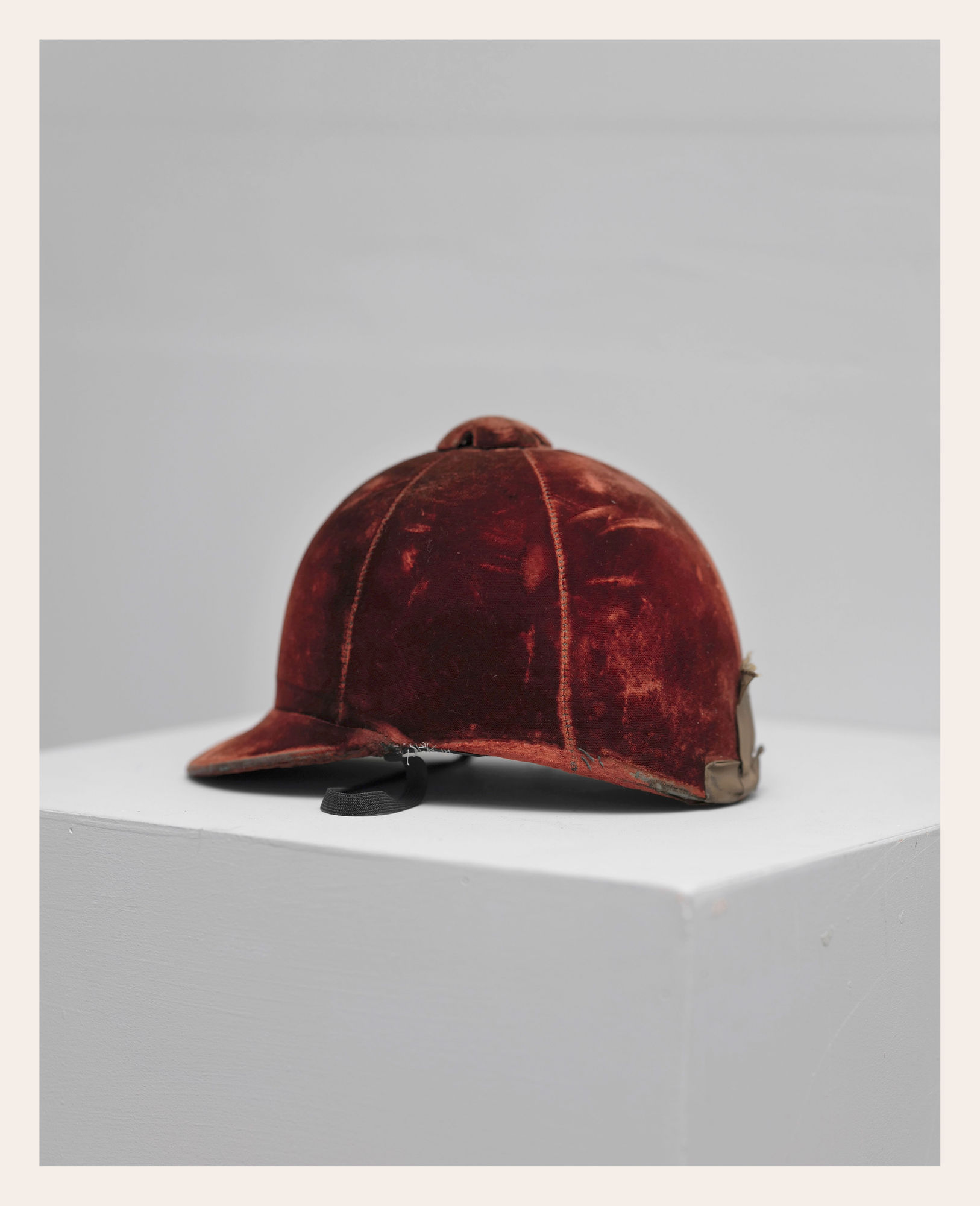 Antique Maroon velvet riding helmet.