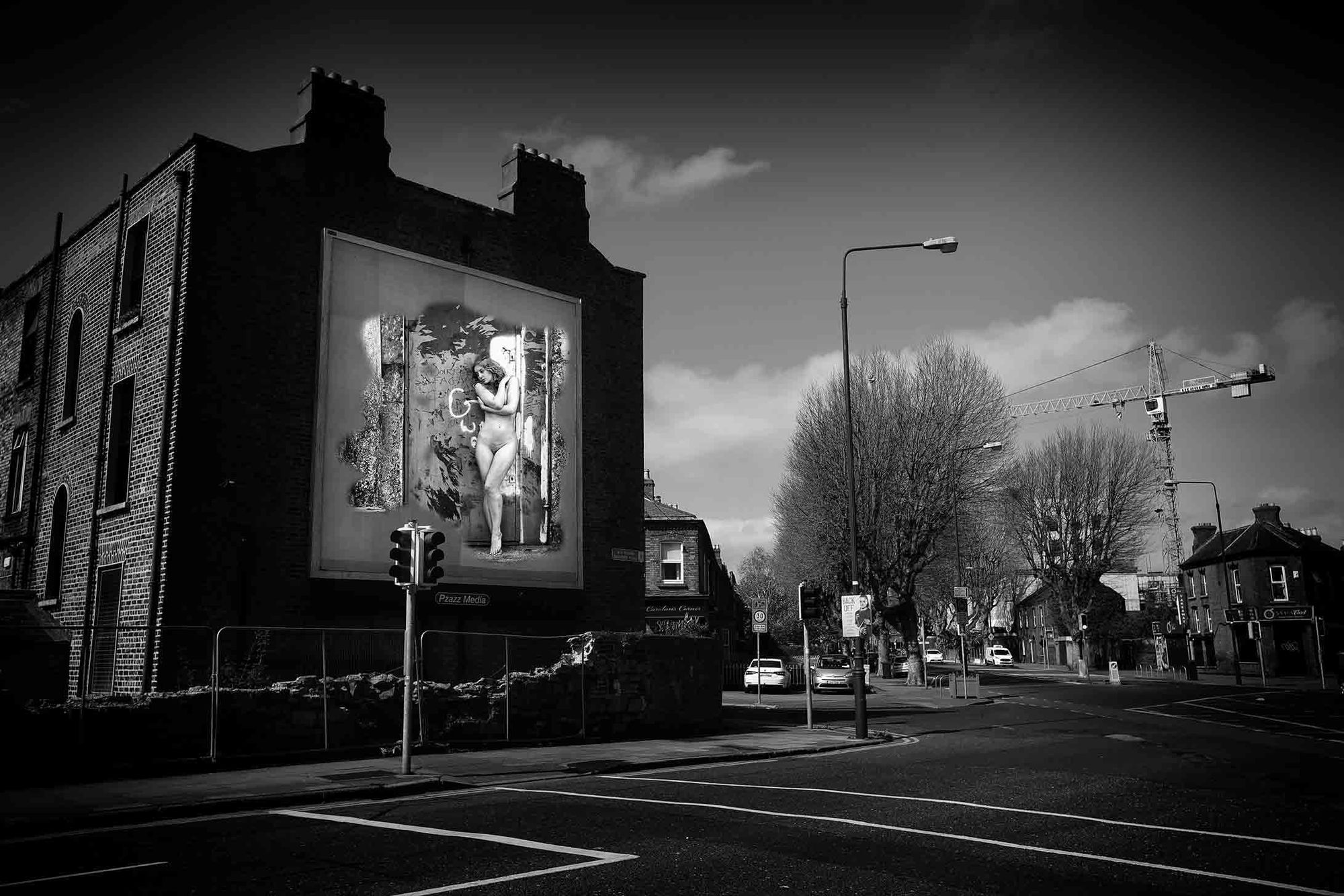 During the Covid - 19 First Lockdown in Dublin City, Ireland. A virtual image on an advertising billboard, in an empty city street. Images from Eamonn Farrell's The Naked City Virtual Exhibition for Dublin Culture Night 2020.