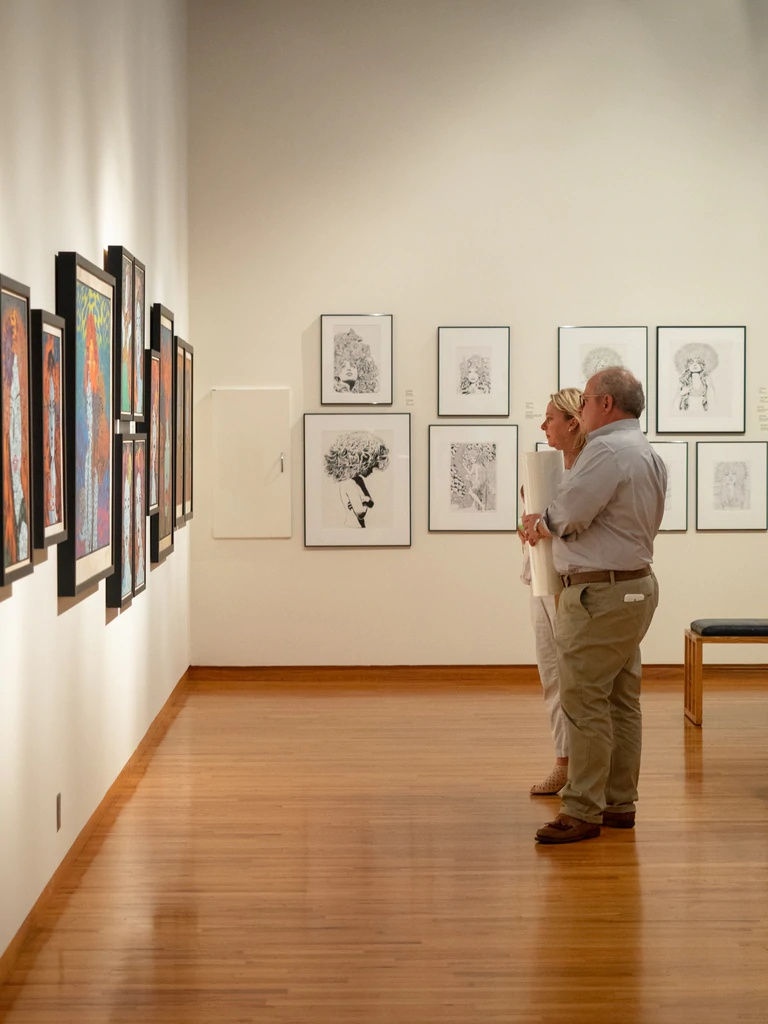 two guests at Chuck Sperry exhibition