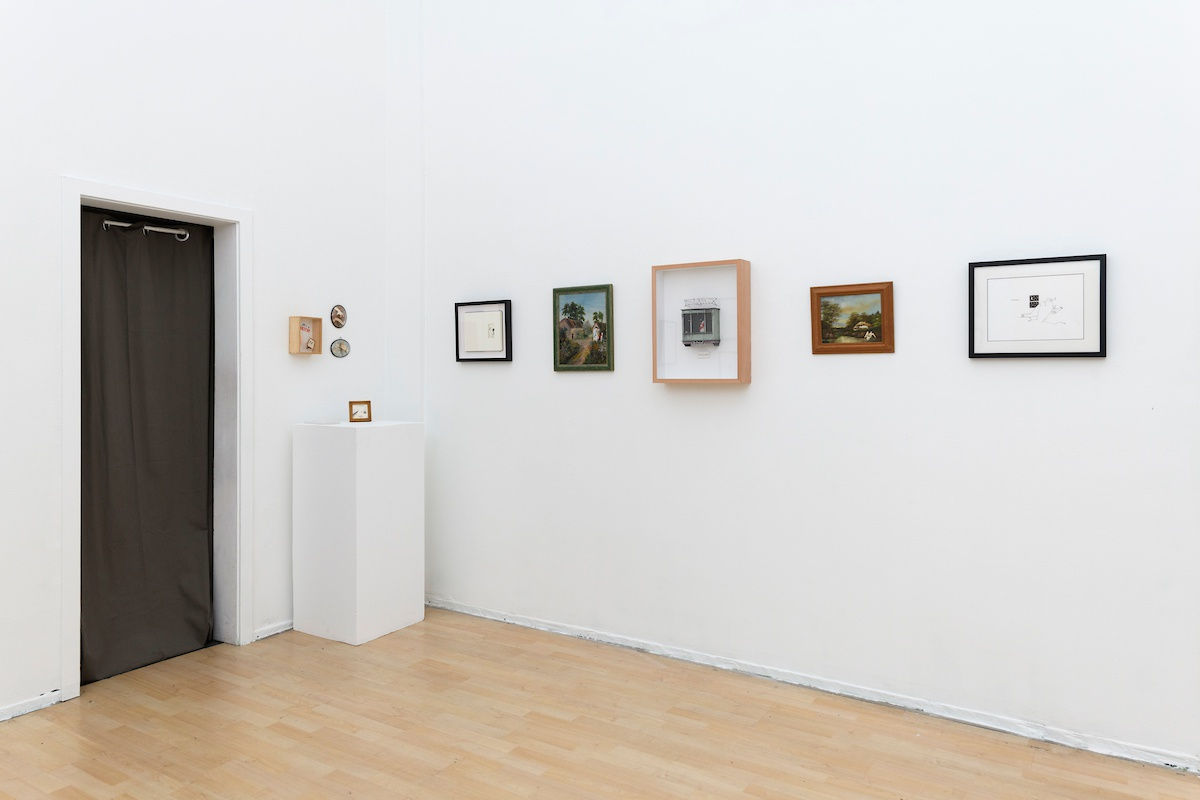 Install photo of framed illustrations by Petite Luxures hung on a wall