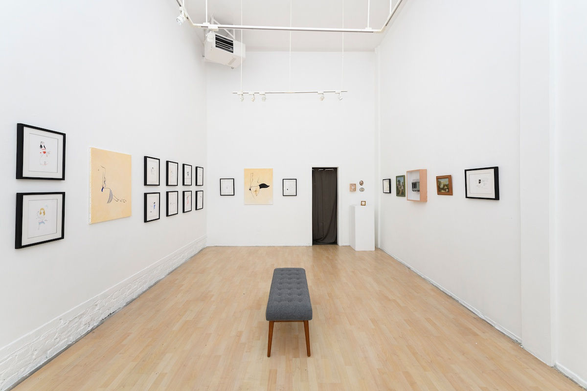 Install photo of framed illustrations by Petite Luxures hung on a wall