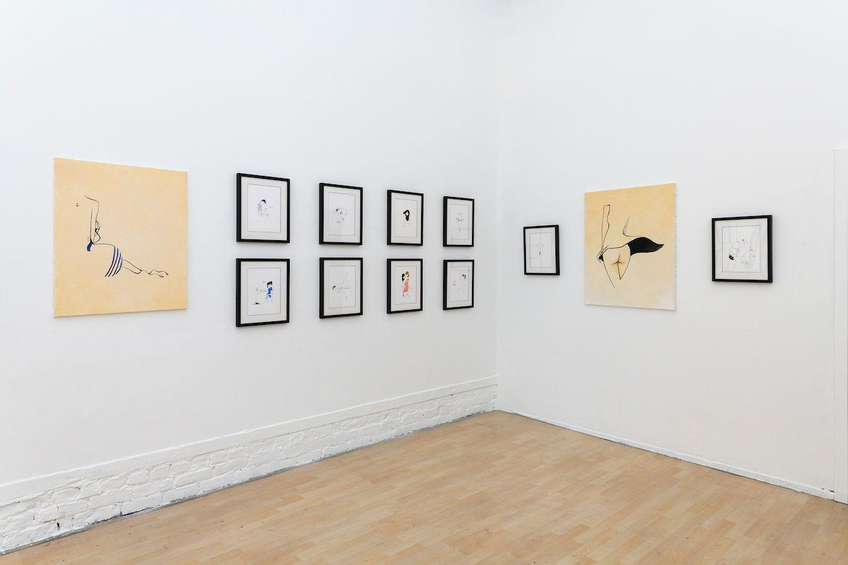 Install photo of framed illustrations by Petite Luxures hung on a wall