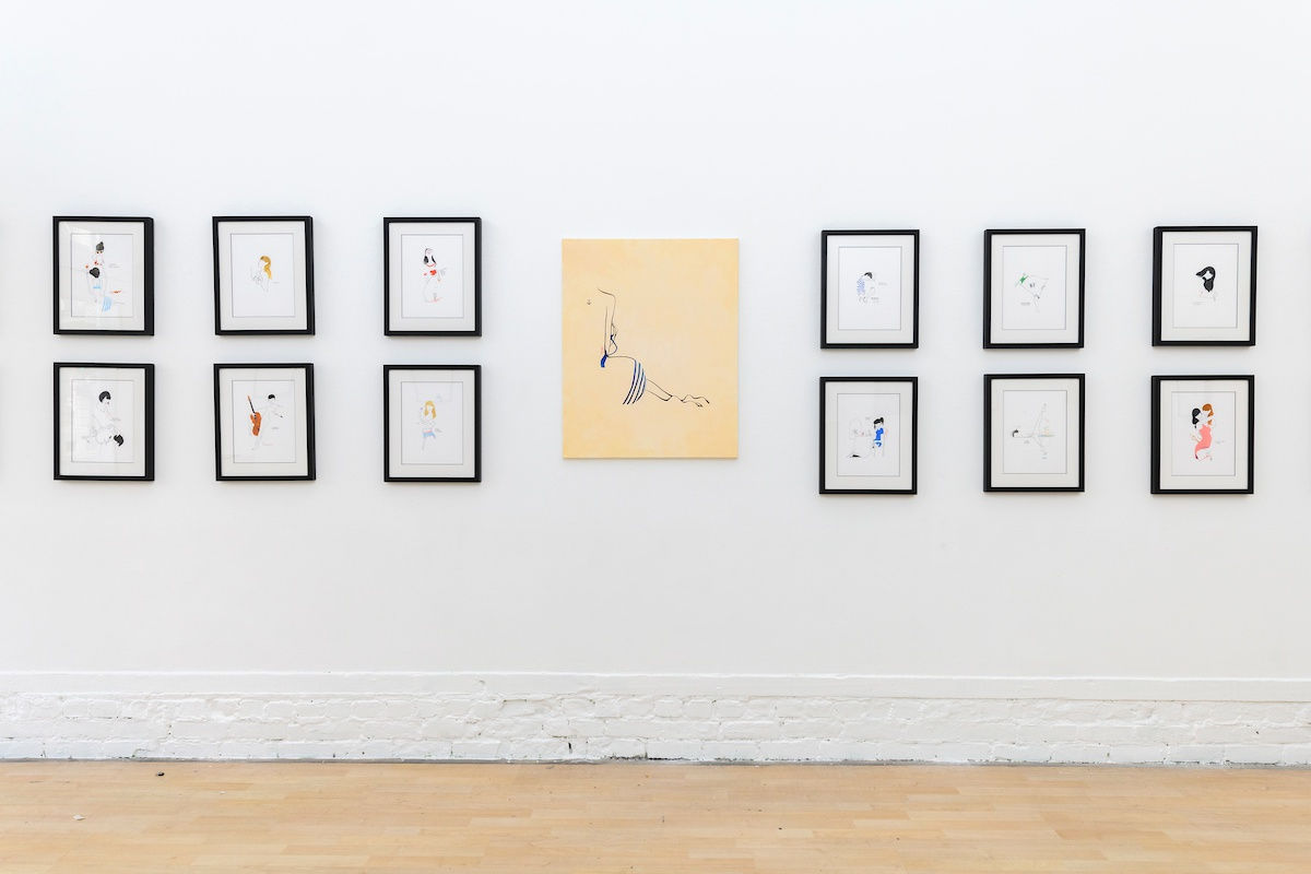 Install photo of framed illustrations by Petite Luxures hung on a wall