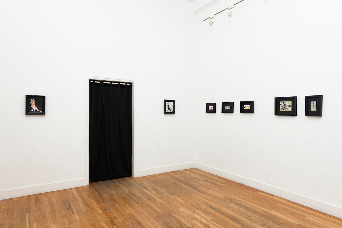 white wall with small framed works by Penny