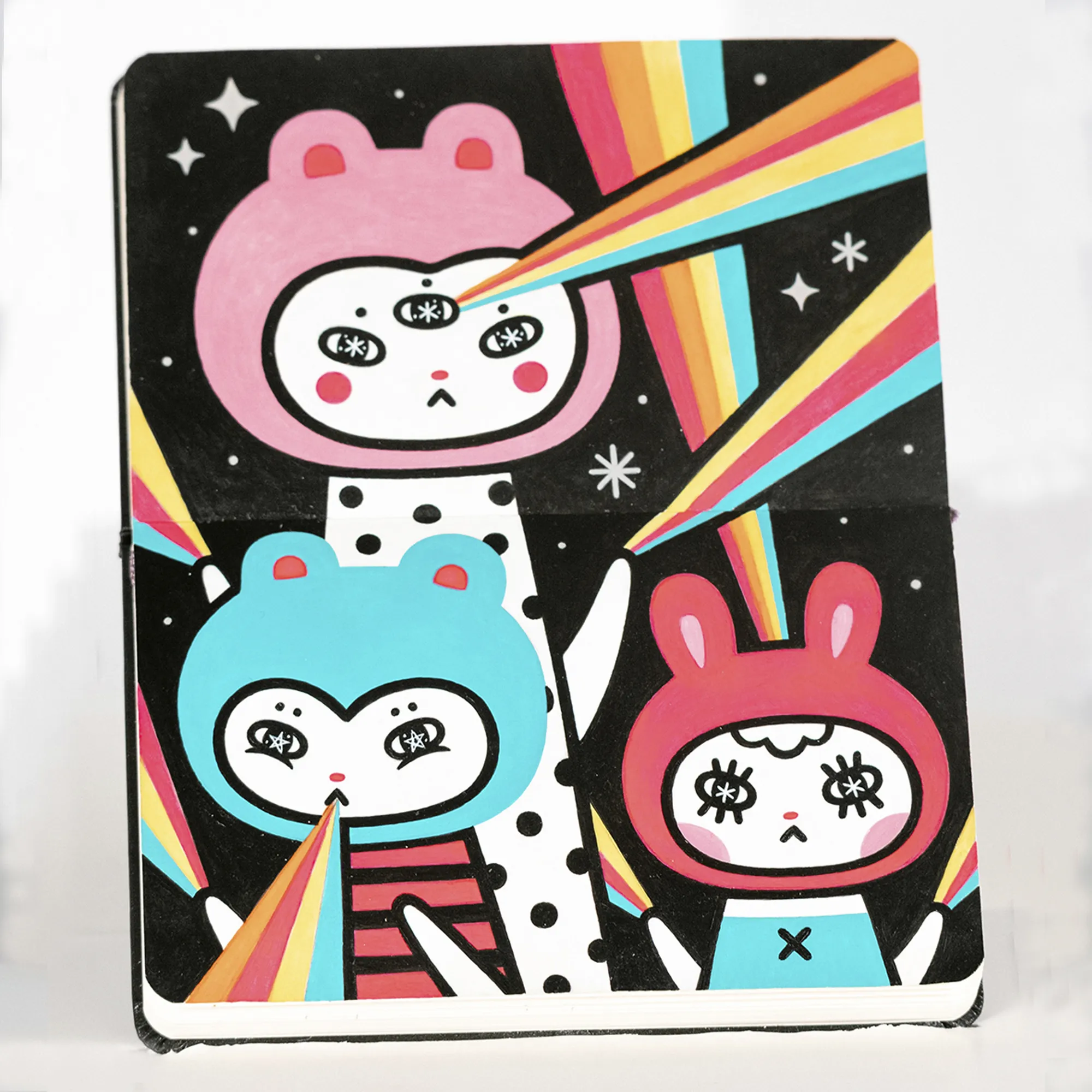 drawing of cat like creatures with rainbows shooting out of their faces and hands