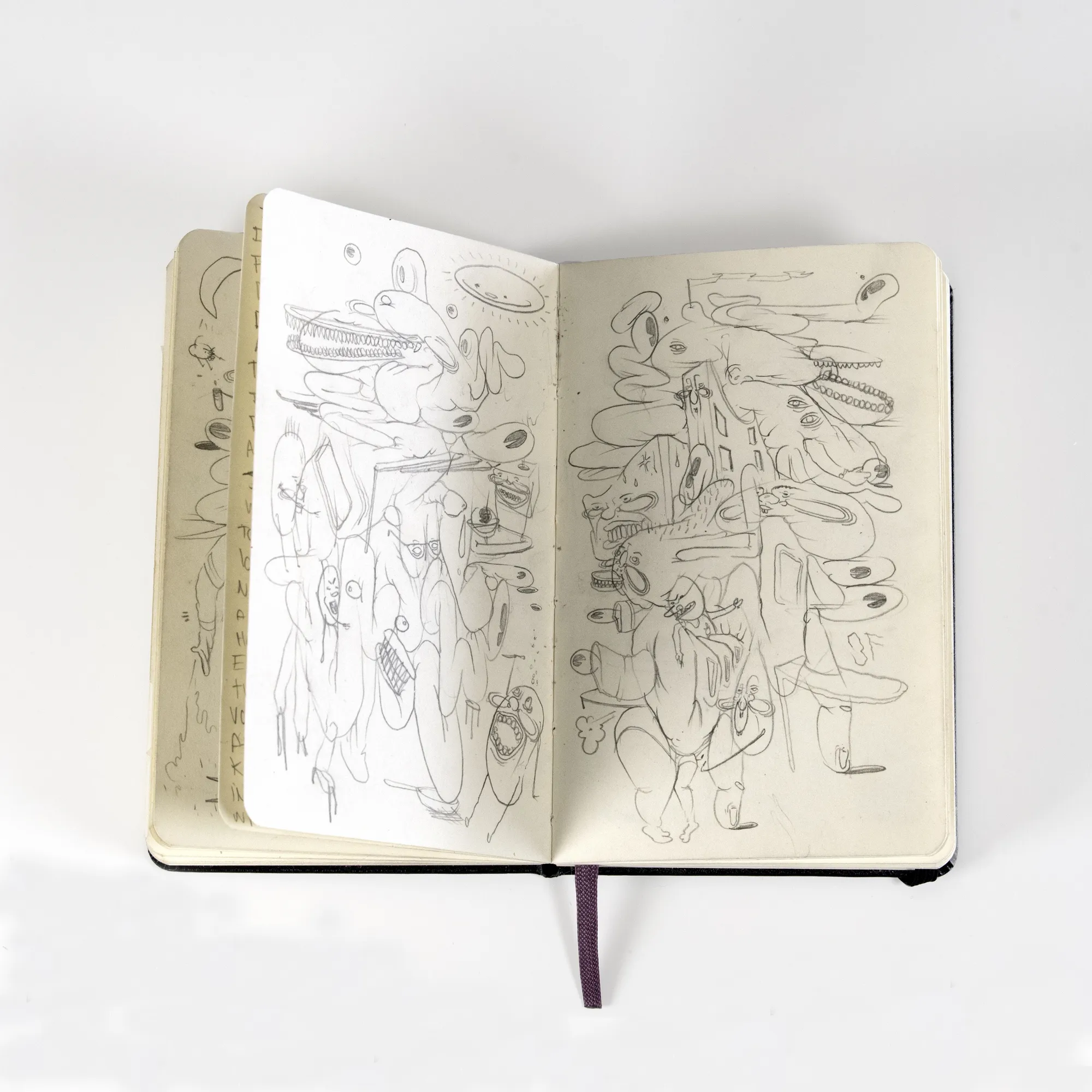 scratchy abstract illustrations inside of a notebook