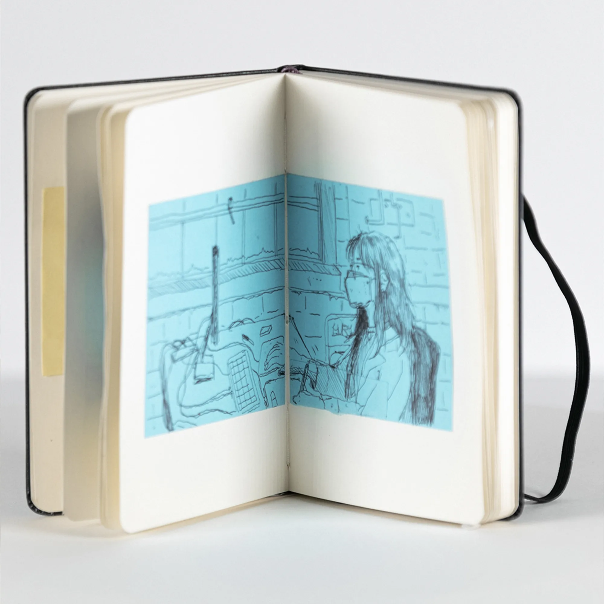 a blue sketch of a girl working at a computer on a desk