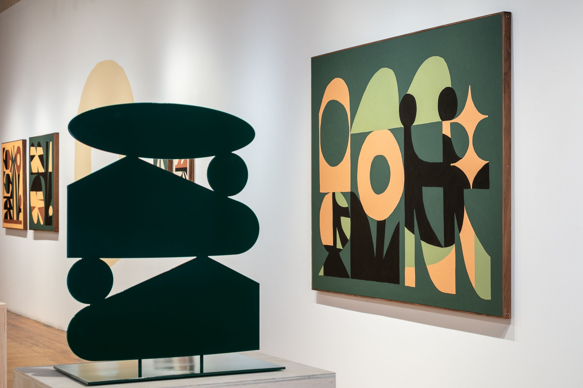 Installation view showing a close-up of the right wall of the gallery. In front is Non Destructive Time Stretch Tall Stack on a plywood pedestal and Seeing the Whole Earth from Space. Further back on the wall is the Mostly Inanimate Subject Matter pair.