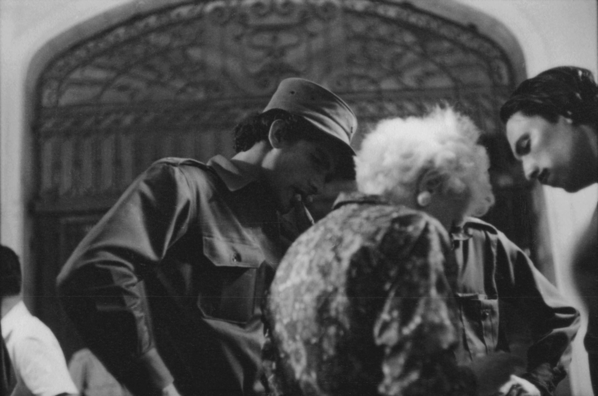 Cuban armed forces and civilians on the street in Havana, 1959