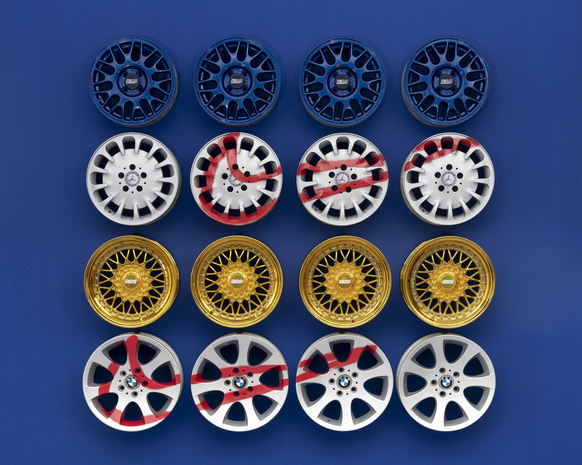 Julien Boudet Cars Sneakers, 2021 Rims (16), spray paint 205 x 205 x 25 cm. 80 x 80 x 9 in.