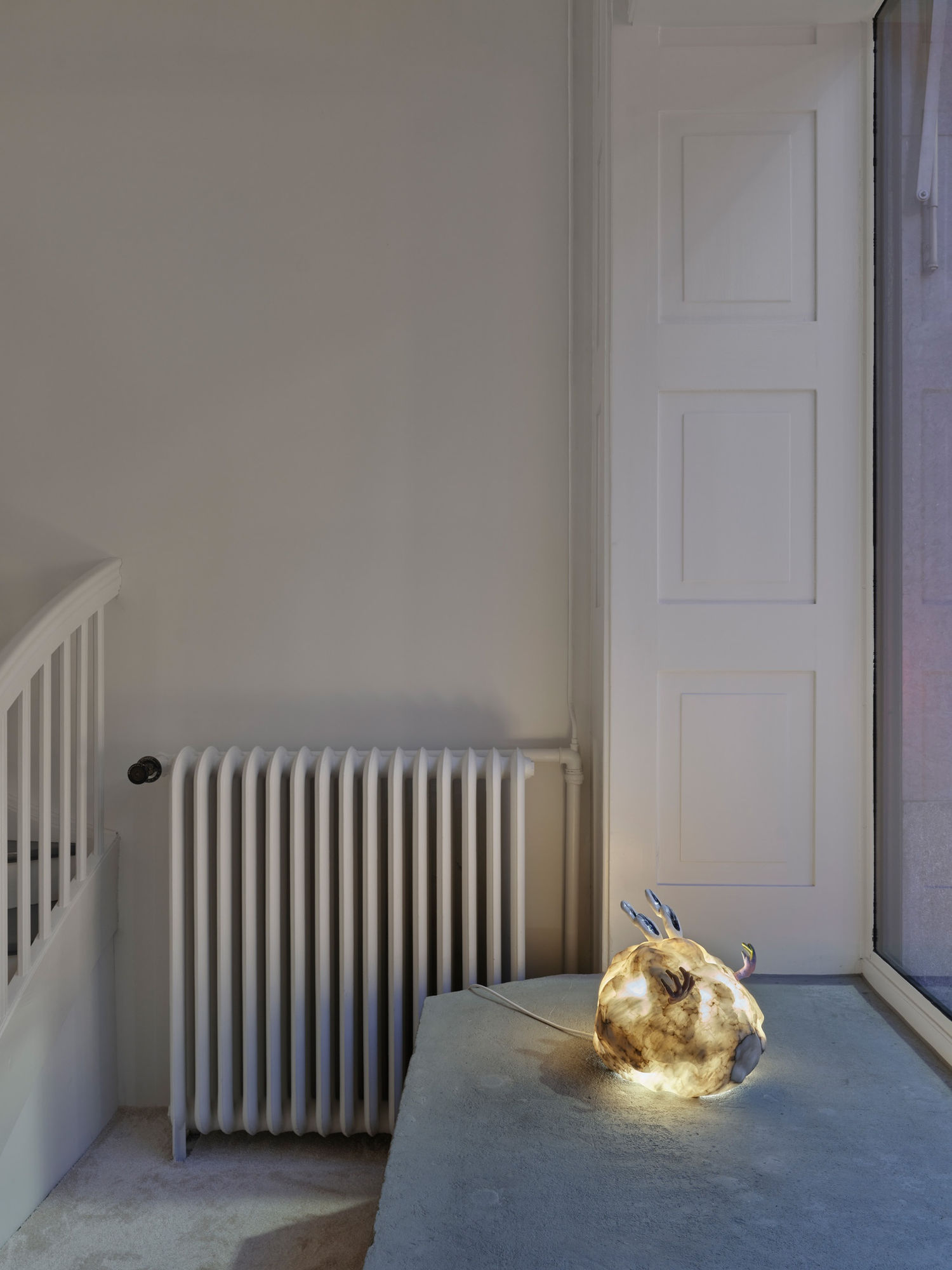 Backfire, 2023, alabaster, polymer clay, spray paint, LED, 35 x 40 x 35 cm