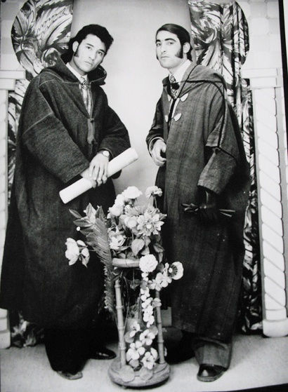 Black and white photograph of two men in a portrait studio