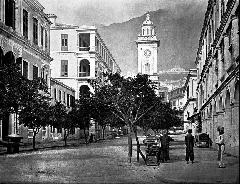 Black and white photograph of a clock tower in Hong Kong