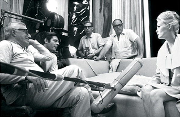 Black and white photograph of Vittorio de Sica, Marcello Mastroianni and Faye Dunaway on the set of “Amanti (A Place for Lovers), Treviso, Italy