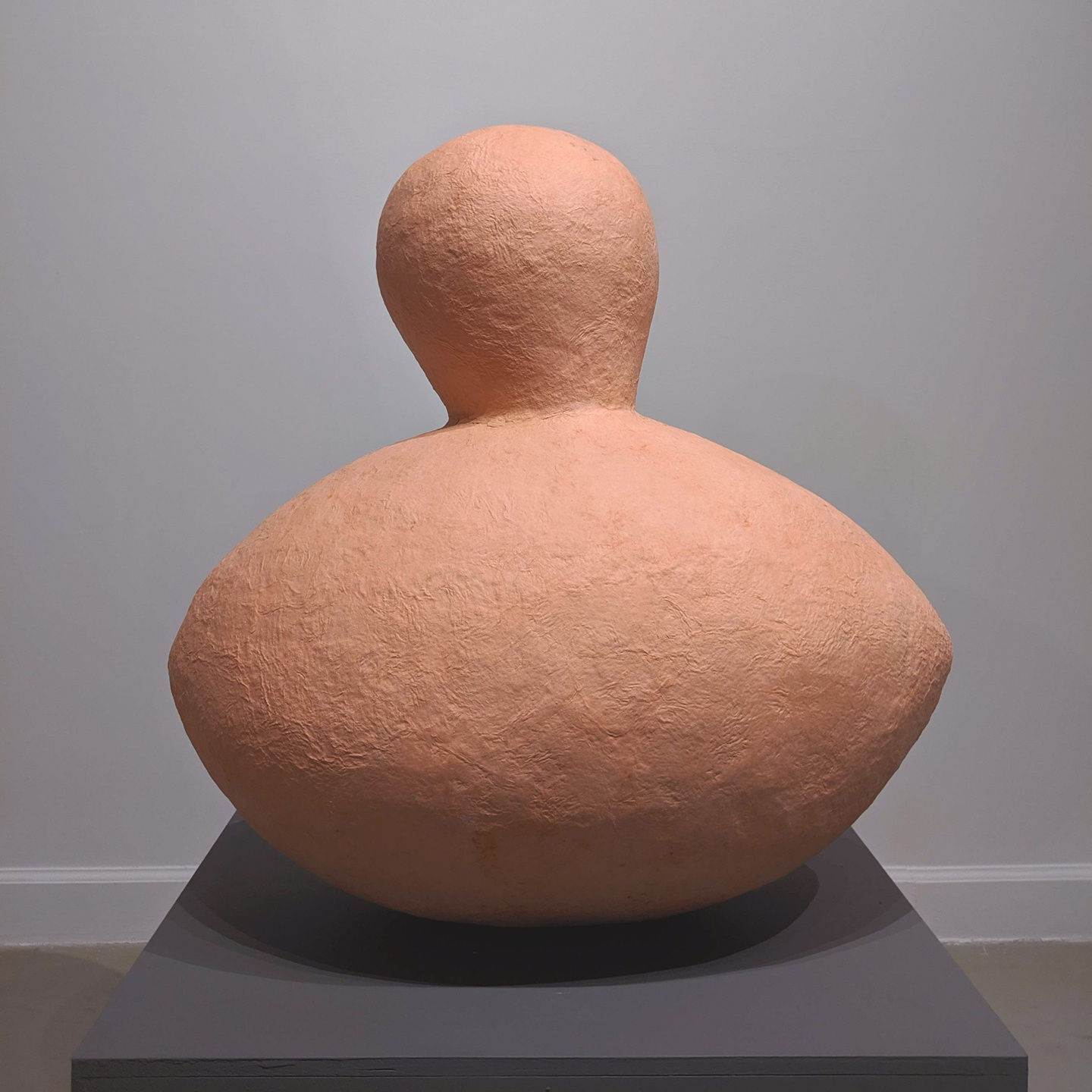 Large peach-colored abstract biomorphic sculpture