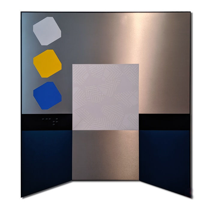 Geometric abstract artwork of mixed media mounted on a white wall