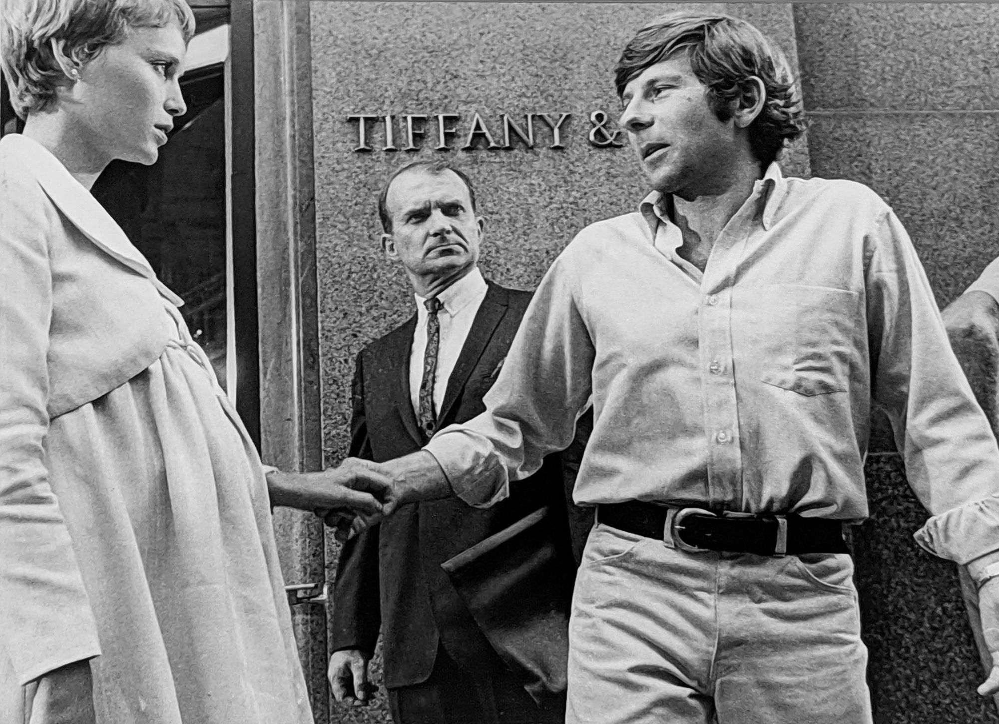 Hatami, Mia Farrow and Roman Polanski setting a scene in front of Tiffany, New York City, on the set of “Rosemary’s Baby”, 1968