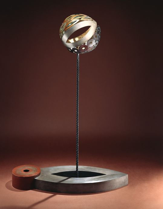 Metal sphere atop a poll, mounted on a stand