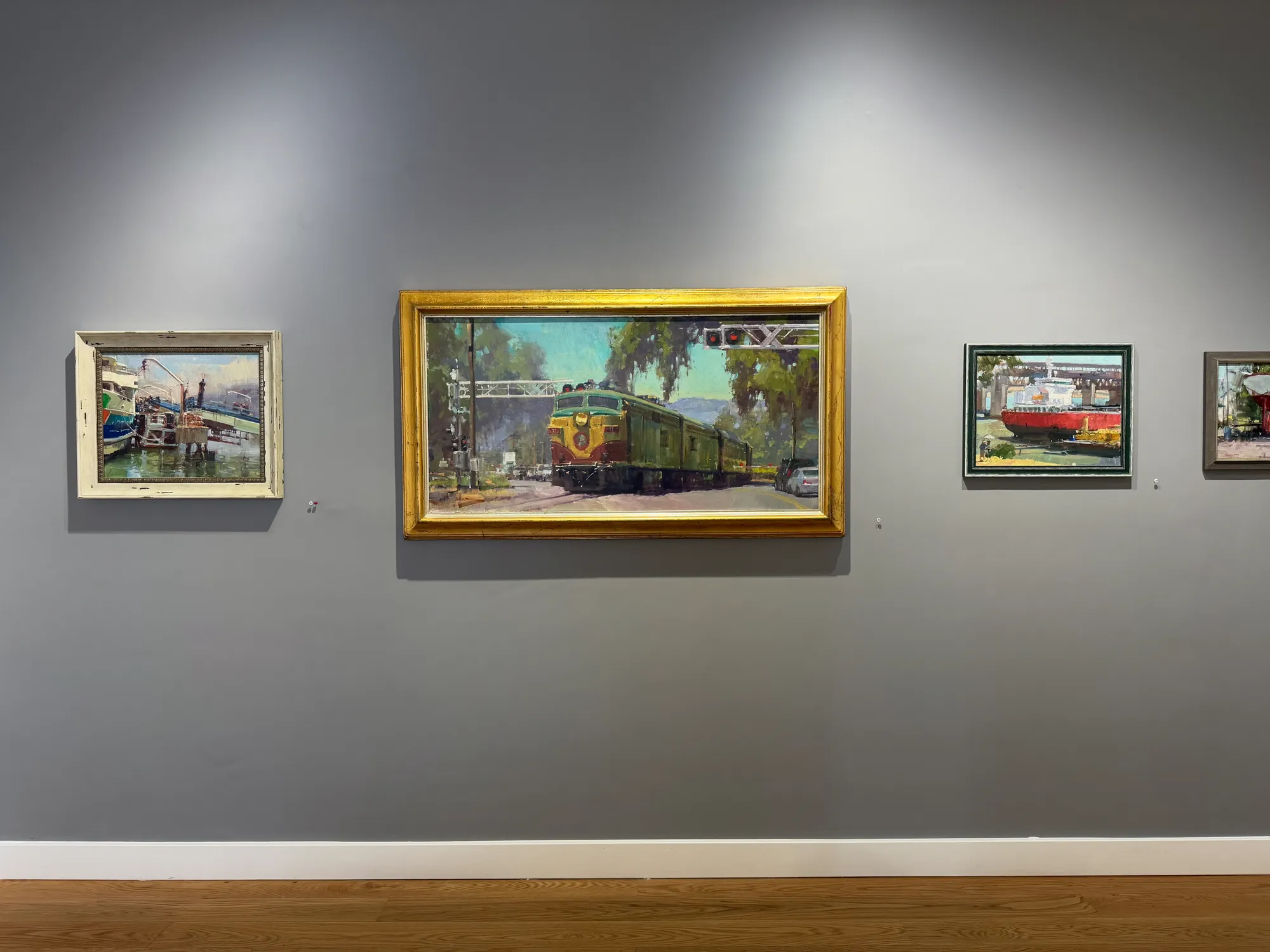 a gallery wall showing paintings by Randall Sexton