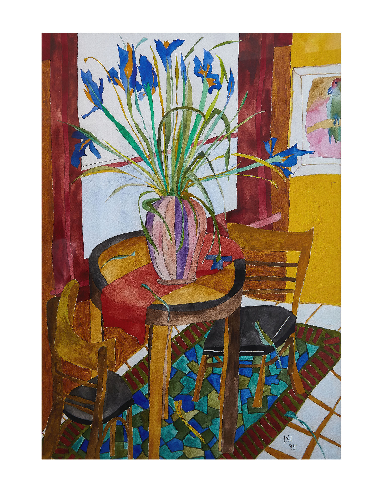 a vase of flowers on a table next to a chair in a living room