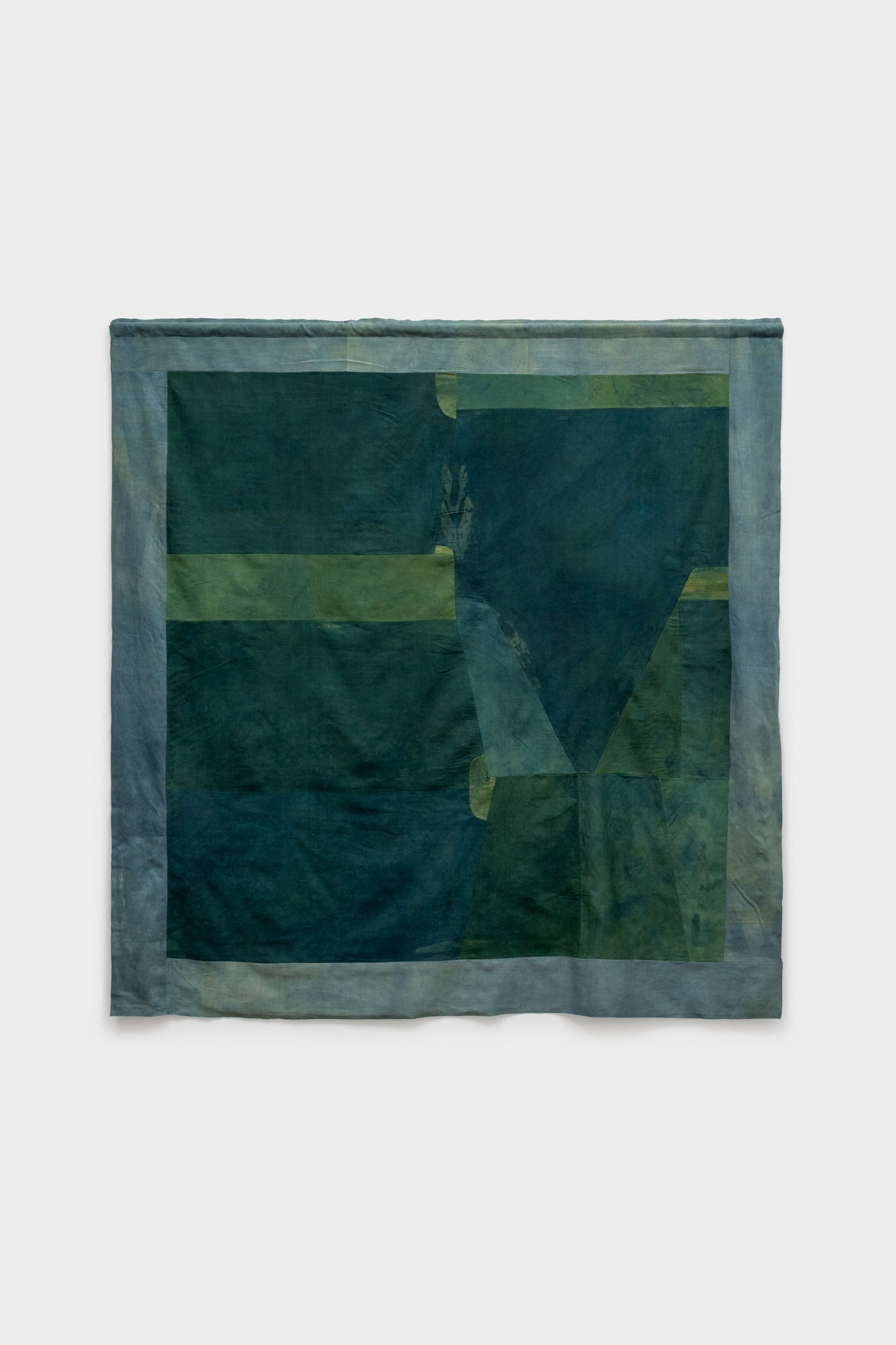 Margaret Hull, ZW Banner (marigold and indigo), 2024, pieced, secondhand sheets dyed in marigold and indigo, 72 x 70 inches. Image courtesy the artist. Photograph by Joe Tiano.