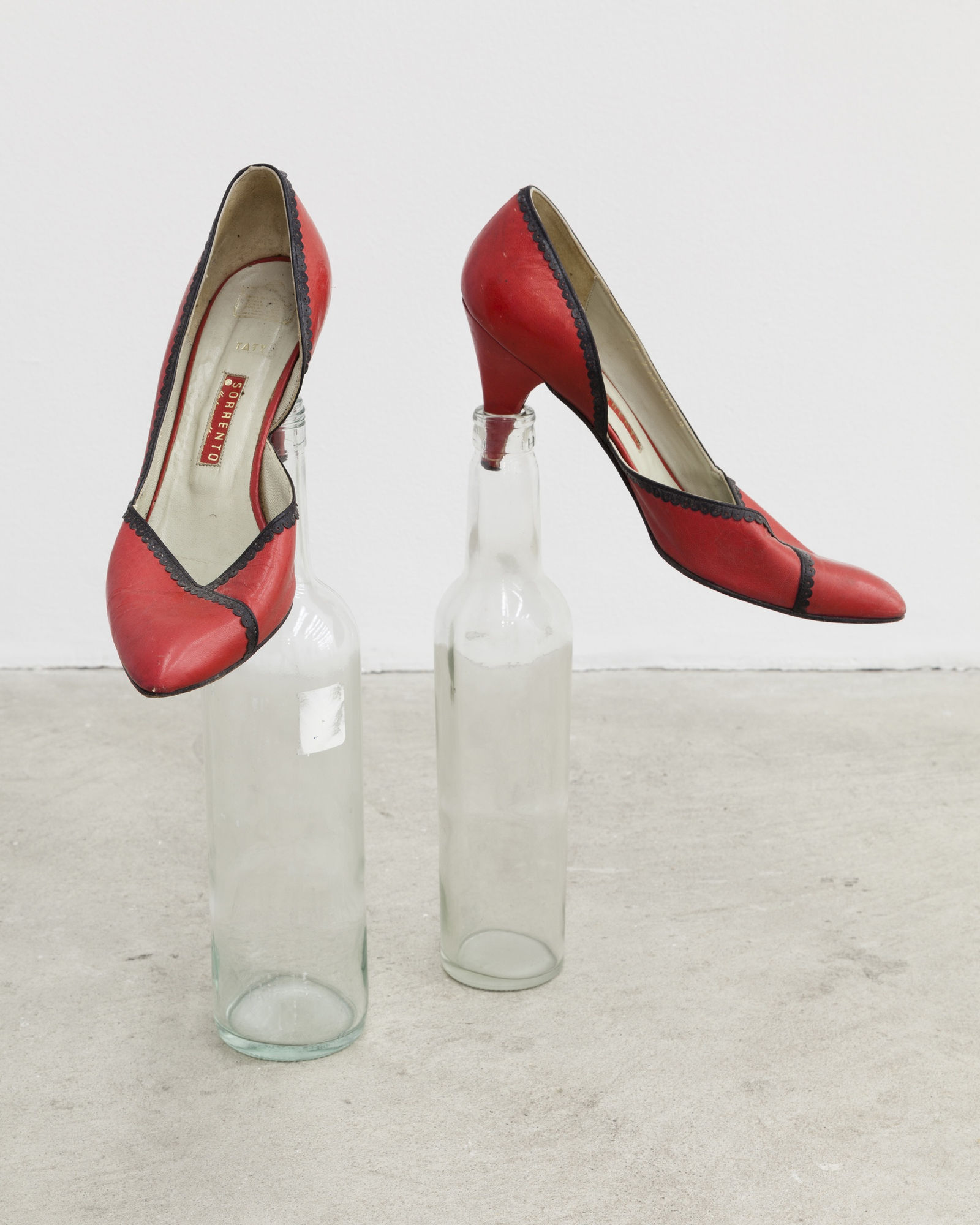 Climent Martin Soto Poking Shoes, 2007 women&rsquo;s shoes, two glass bottles Dimensions variable